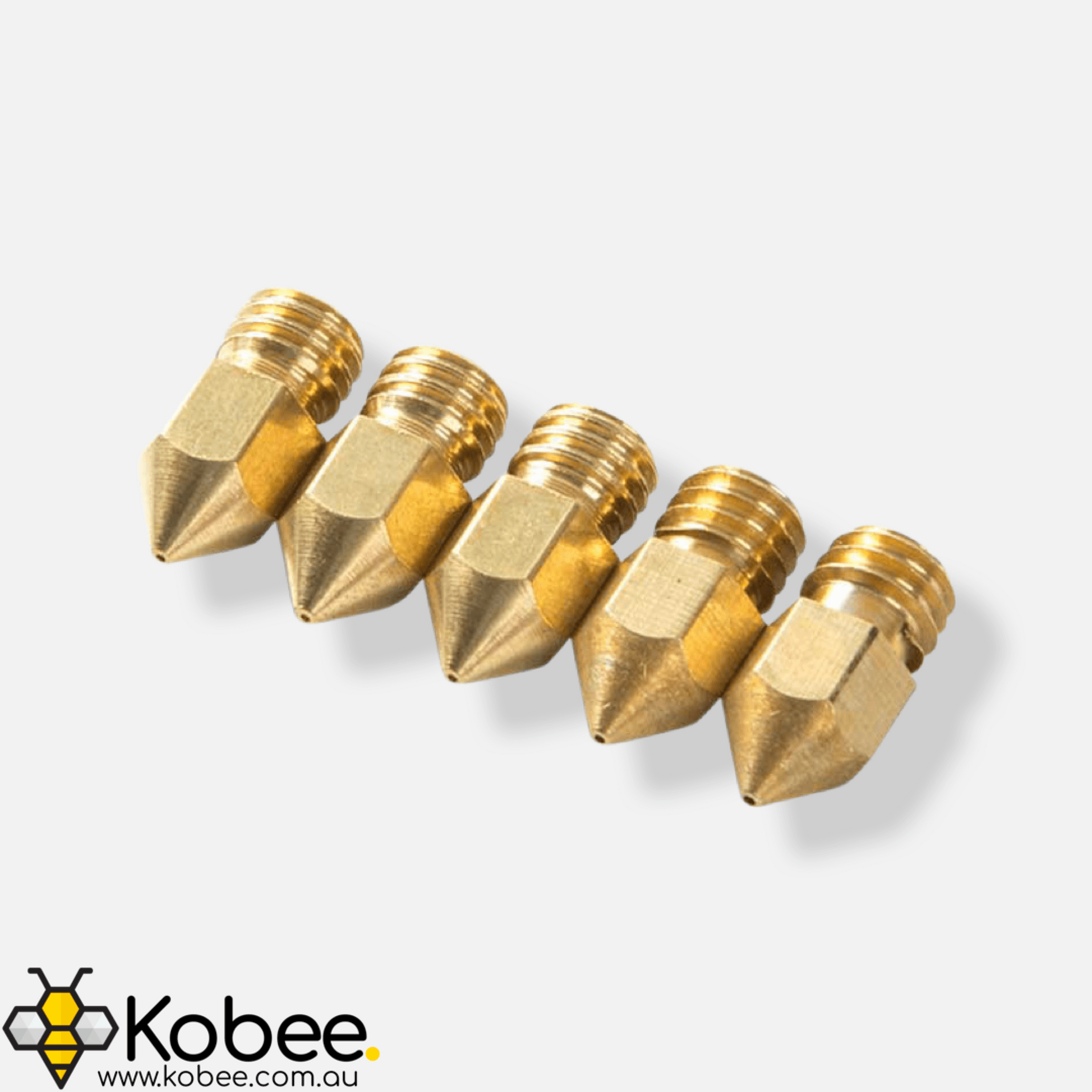 Ender 3 replacement brass nozzle shown beside a 3D printer hot end